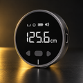 Black digital measuring wheel on black and gold background