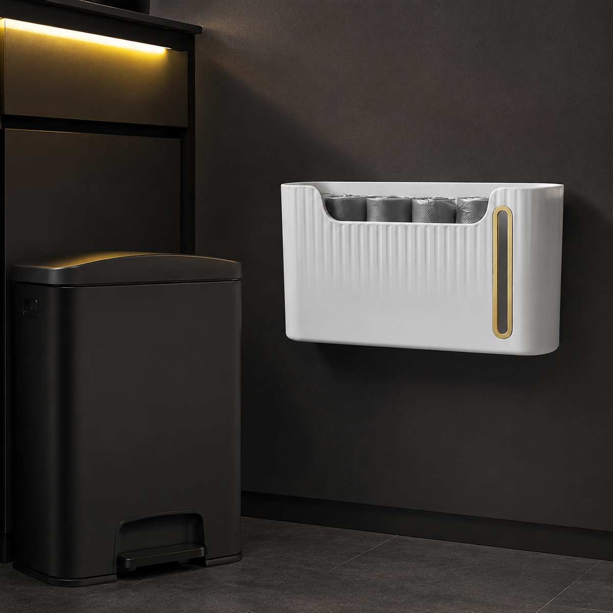 Wall-mounted bag dispenser beside a kitchen waste bin