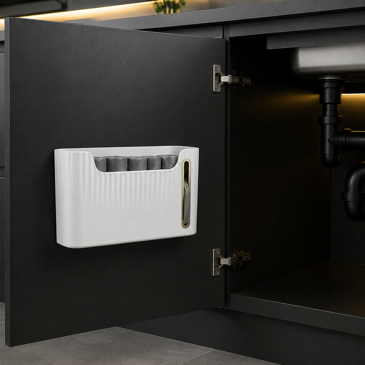 Garbage bag dispenser mounted inside an under-sink cabinet